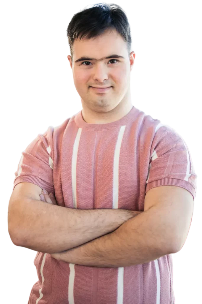 Happy man with down syndrome smiling at camera